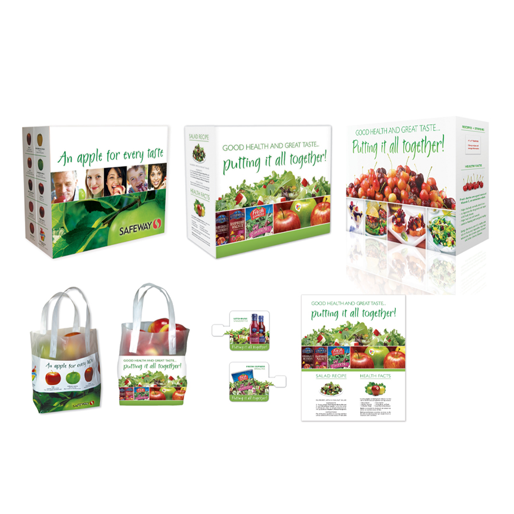 Safeway apple and salad packaging with vibrant images of fresh apples, salad ingredients, and health-focused branding. Includes carry bags and boxes highlighting health benefits and salad recipes.